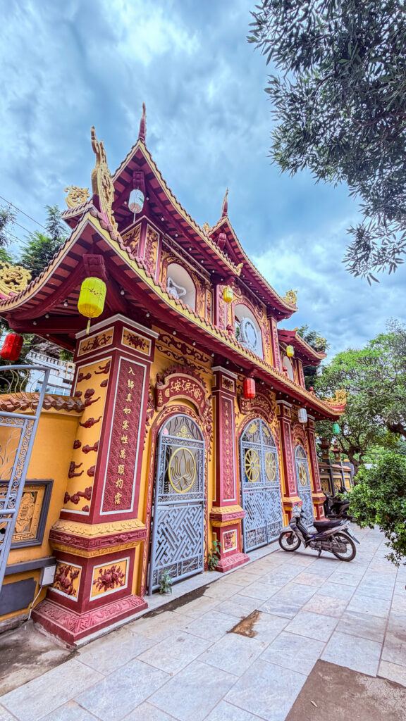 Pho Da Temple Quan Am statue on lake and Buddhist university Da Nang