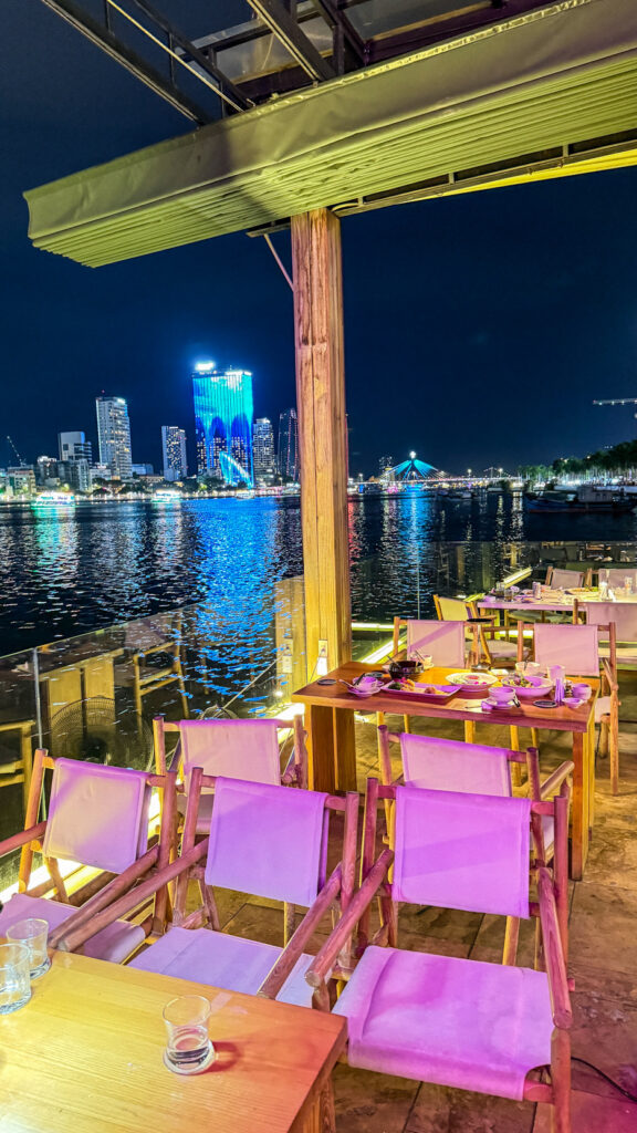 The View restaurant on Happy Yacht with Dragon Bridge fire show at sunset

