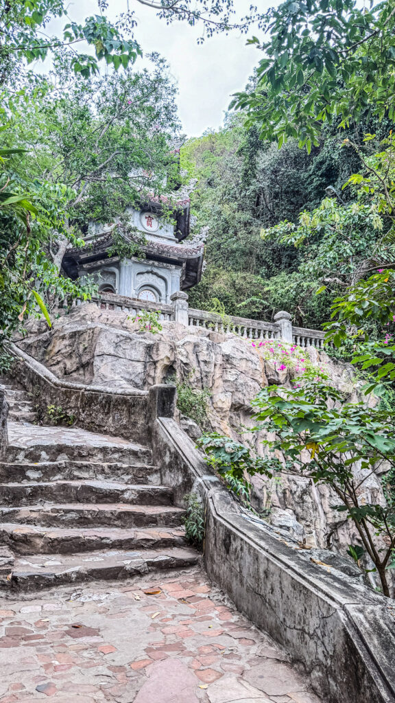 Pagoda courtyard with incense and mountain views in Marble Mountains Vietnam

