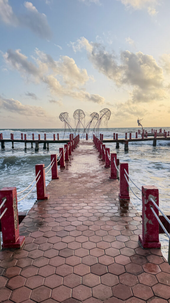 Sunset Sanato Phu Quoc giant elephant sculptures on stilts at sunset
