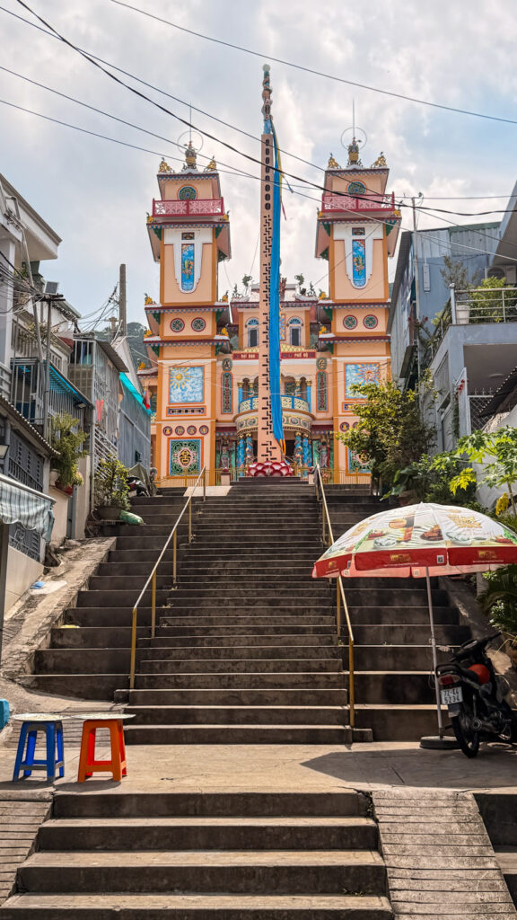 Small Buddhist temple surrounded by greenery in Vung Tau
