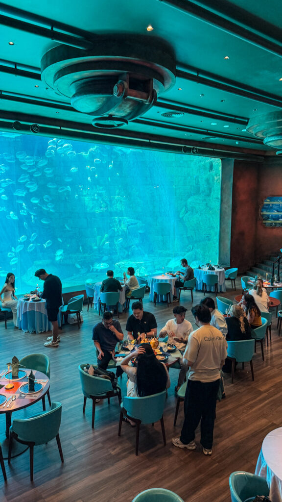 Deep Sea Restaurant VinWonders Phu Quoc sharks swimming underwater