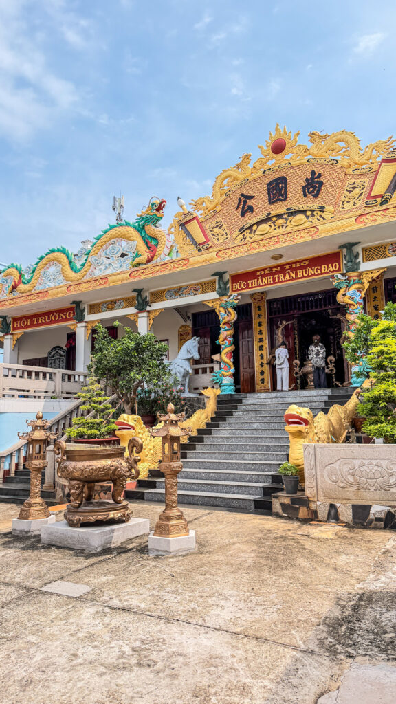 Temple building with traditional Vietnamese architectural details
