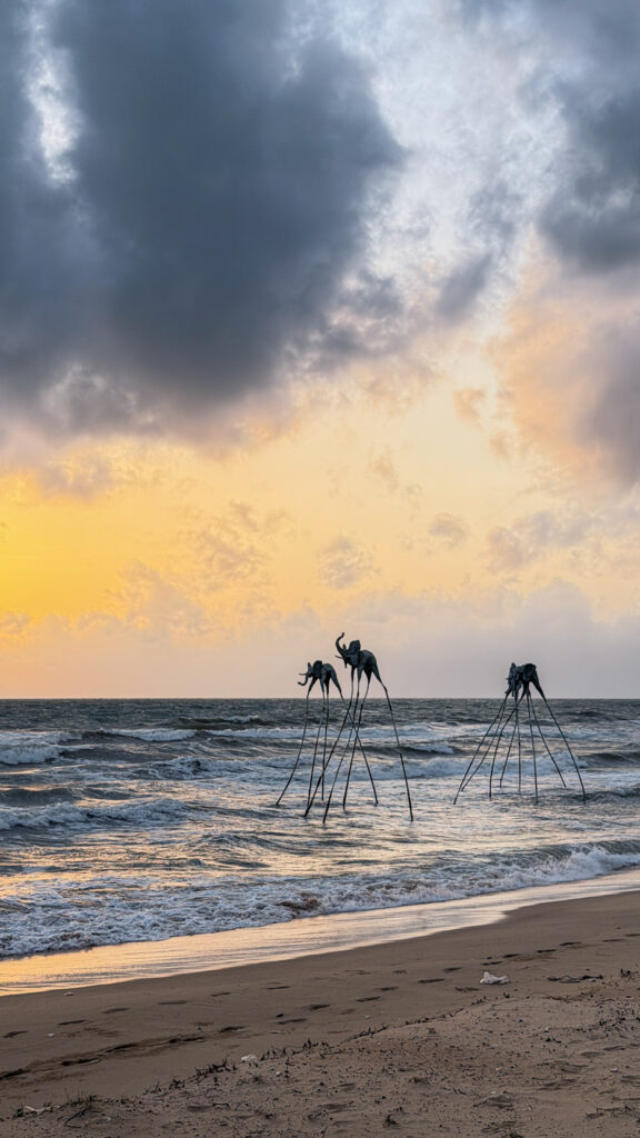 Sunset Sanato Phu Quoc giant elephant sculptures on stilts at sunset