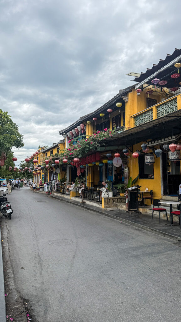 Lantern-lit street in Hoi An Ancient Town at night with colorful hanging lanterns

