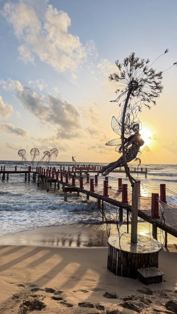 Sunset Sanato Phu Quoc giant elephant sculptures on stilts at sunset
