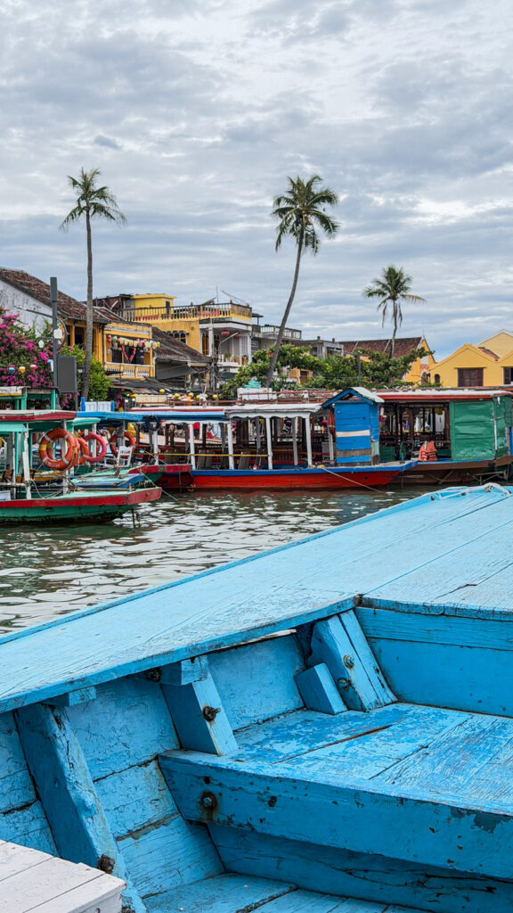 Tourists in traditional basket boat with local rower Hoi An

