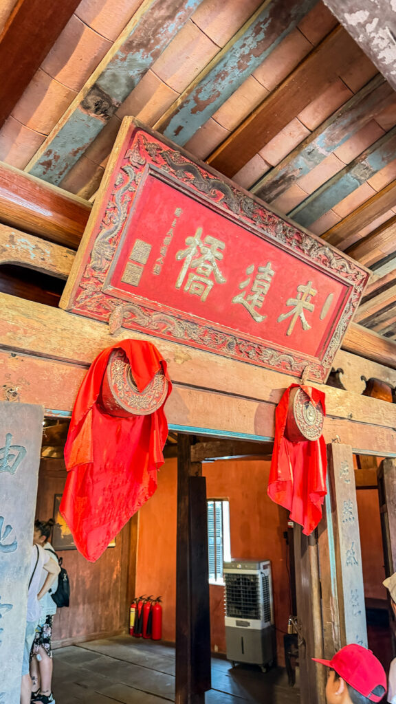 Japanese Bridge with temple inside and dog statues Hoi An

