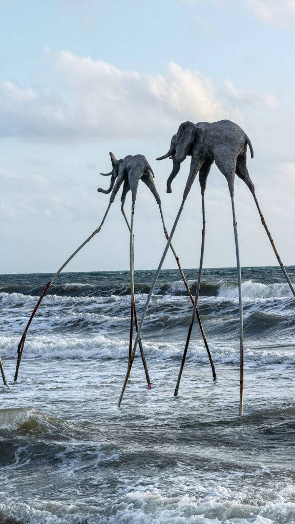 Sunset Sanato Phu Quoc giant elephant sculptures on stilts at sunset