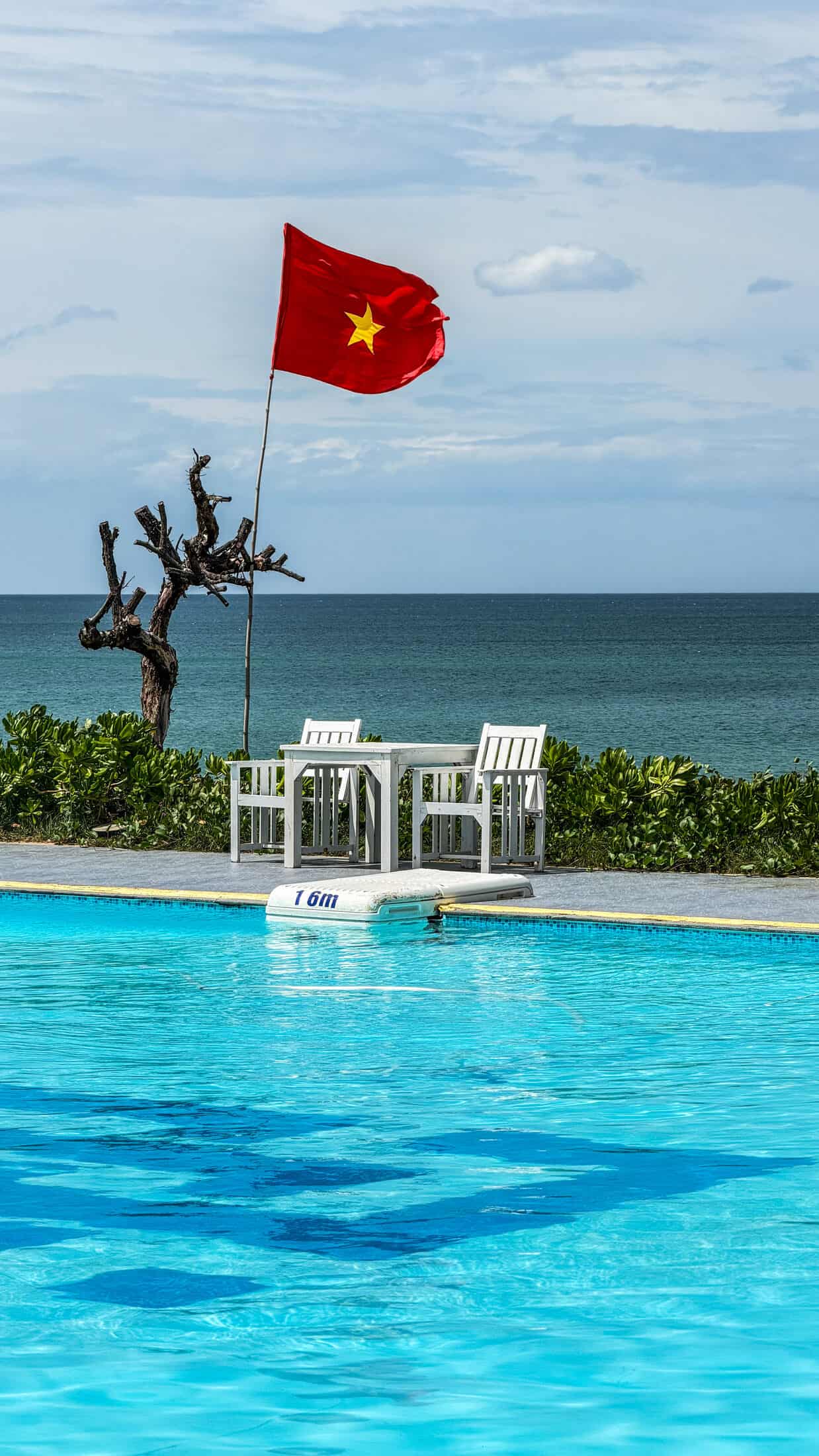 Pool deck with Vietnamese flag at Ana Resort Phu Yen