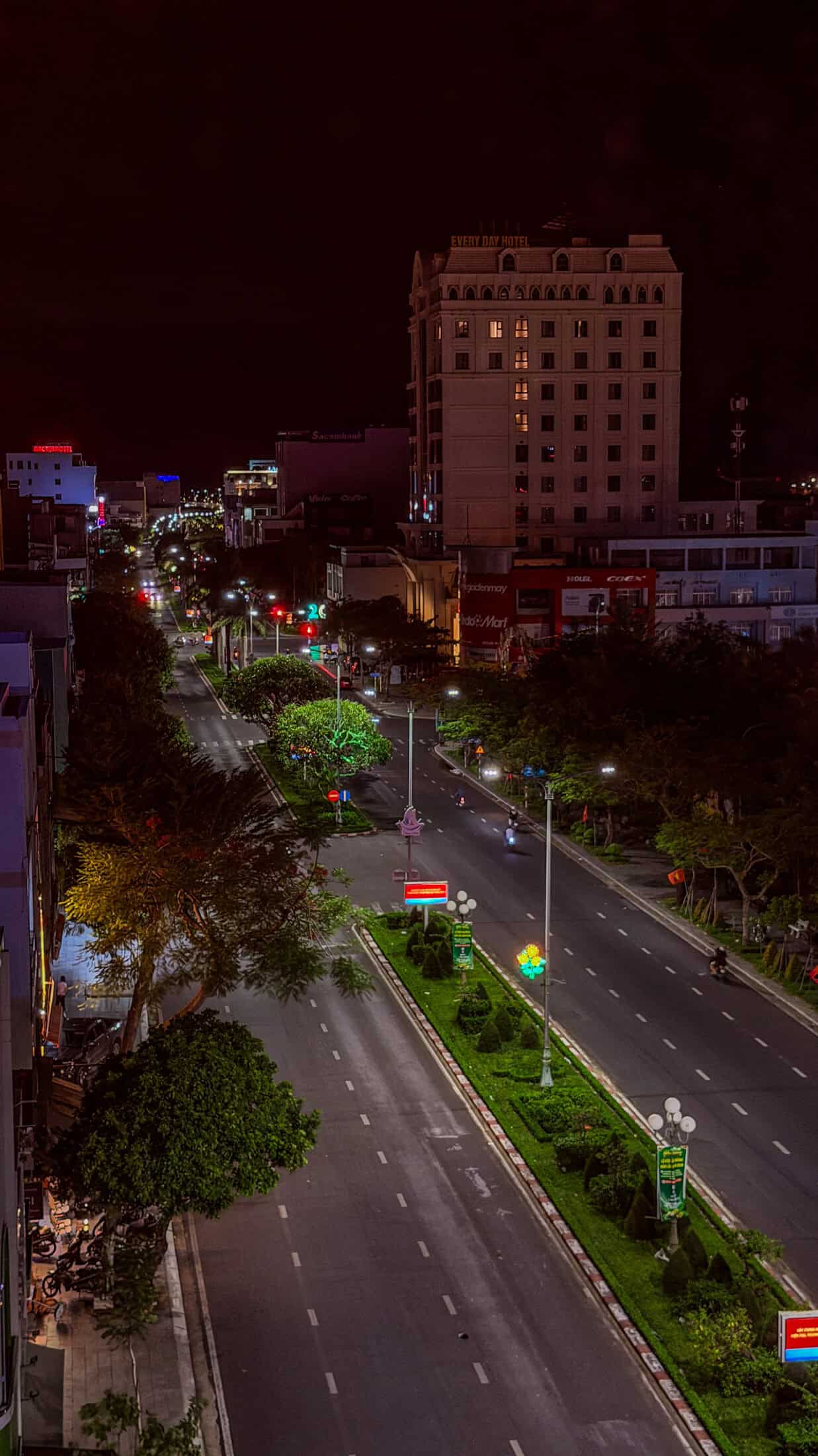 Night view down a lit boulevard from Coconut Rooftop, Tuy Hoa
