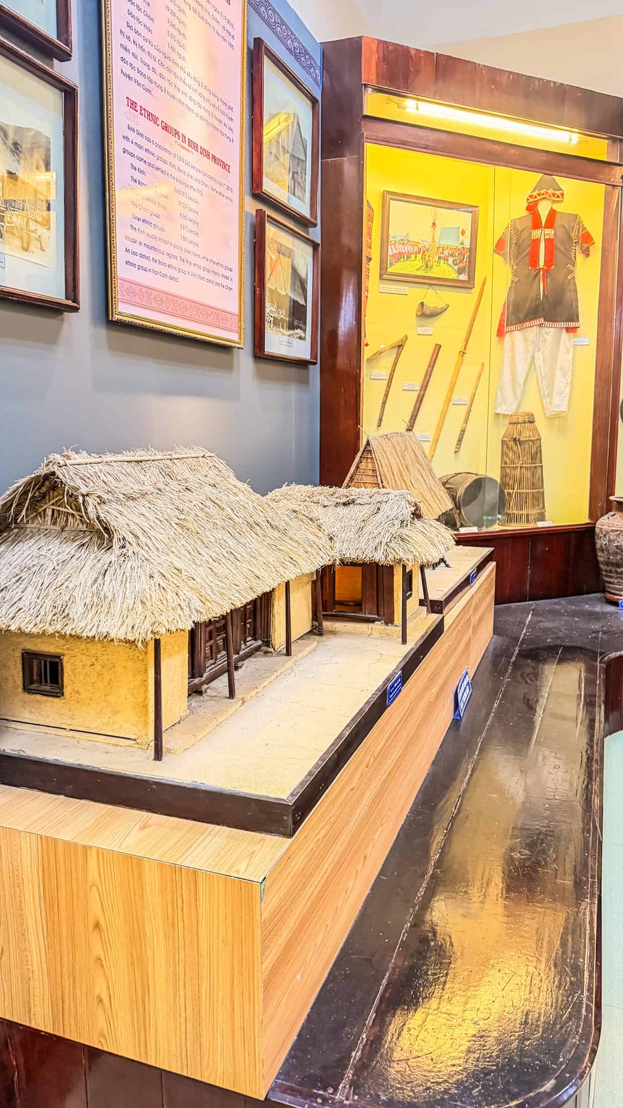 Traditional stilt house model and ethnic costume display, Gia Lai Museum Quy Nhon