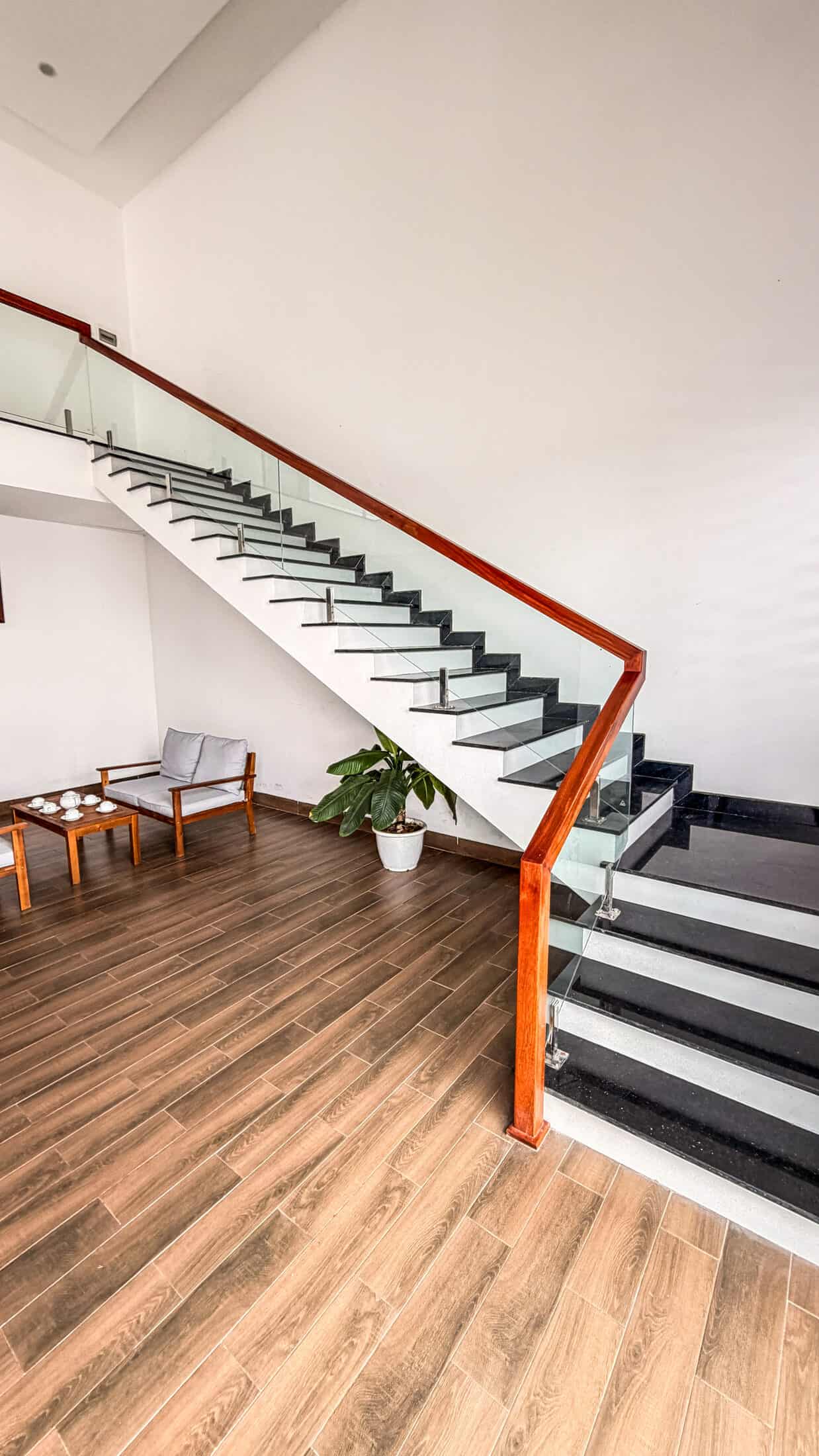 Glass-railed staircase inside La Costa Resort, Quy Nhon
