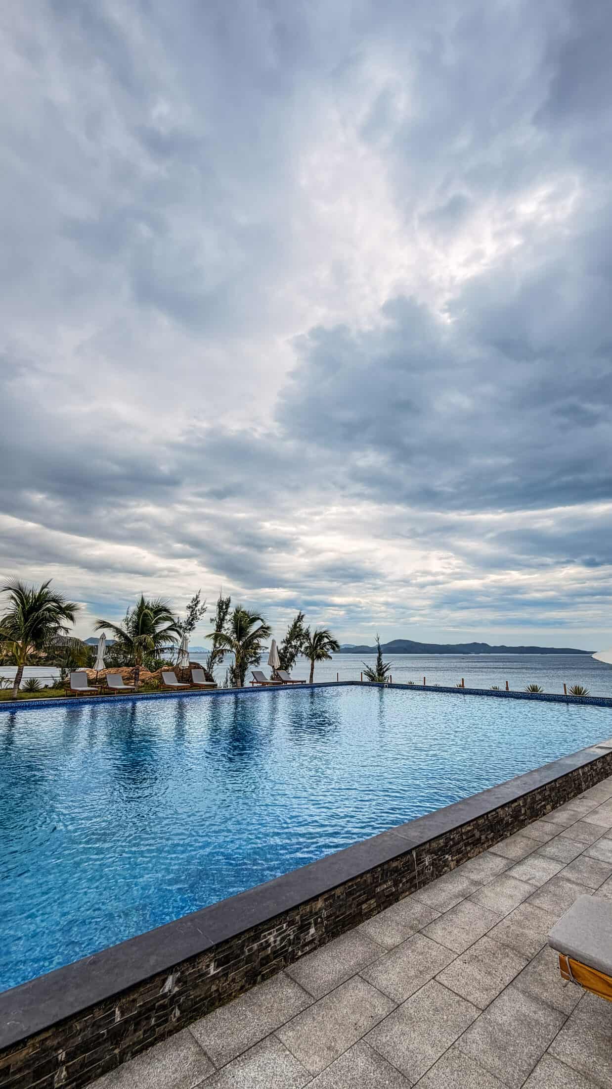 Wide view of the infinity pool and sea at La Costa Resort, Quy Nhon