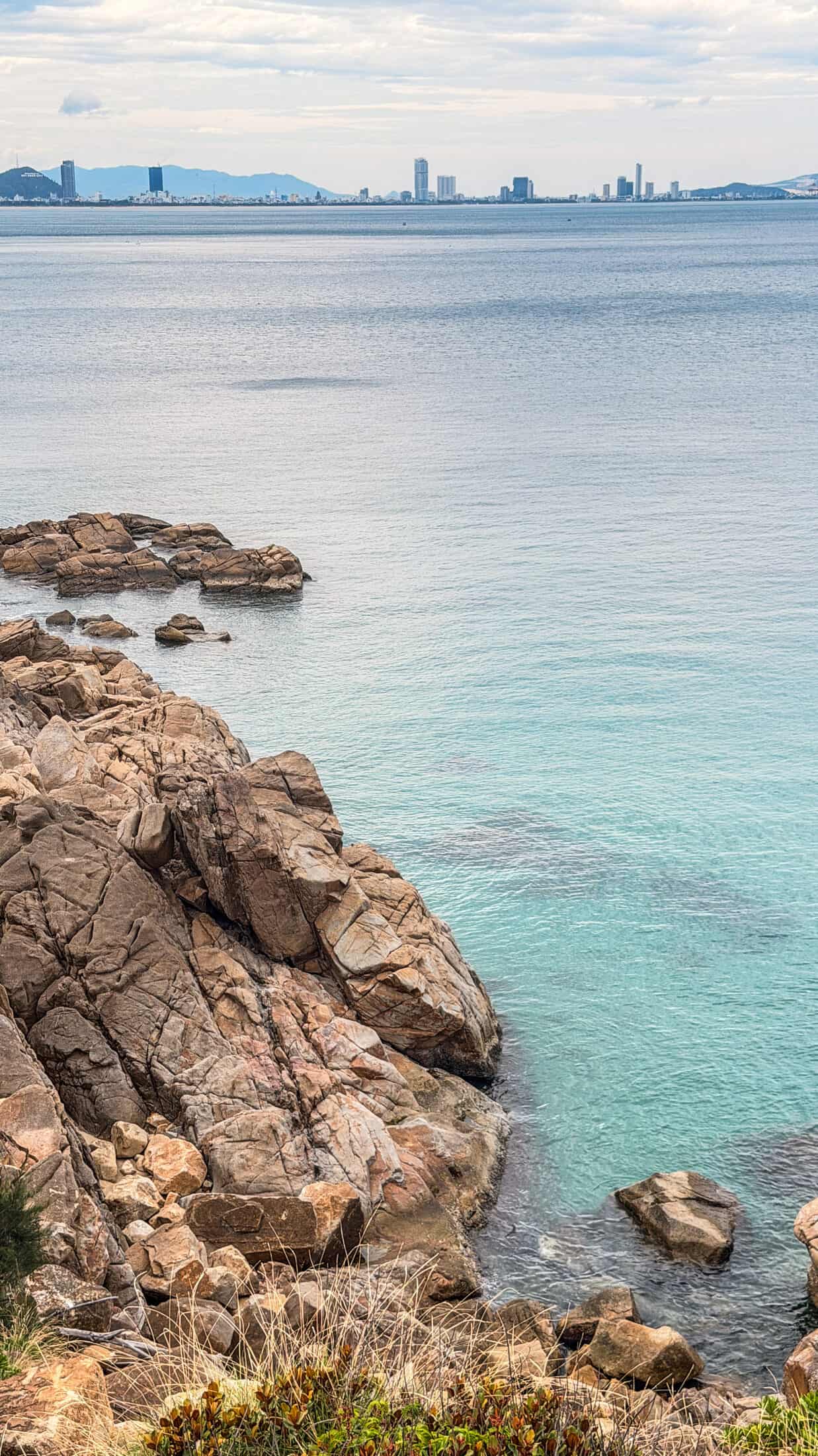 Turquoise water along the rocky coast at La Costa Resort, Quy Nhon