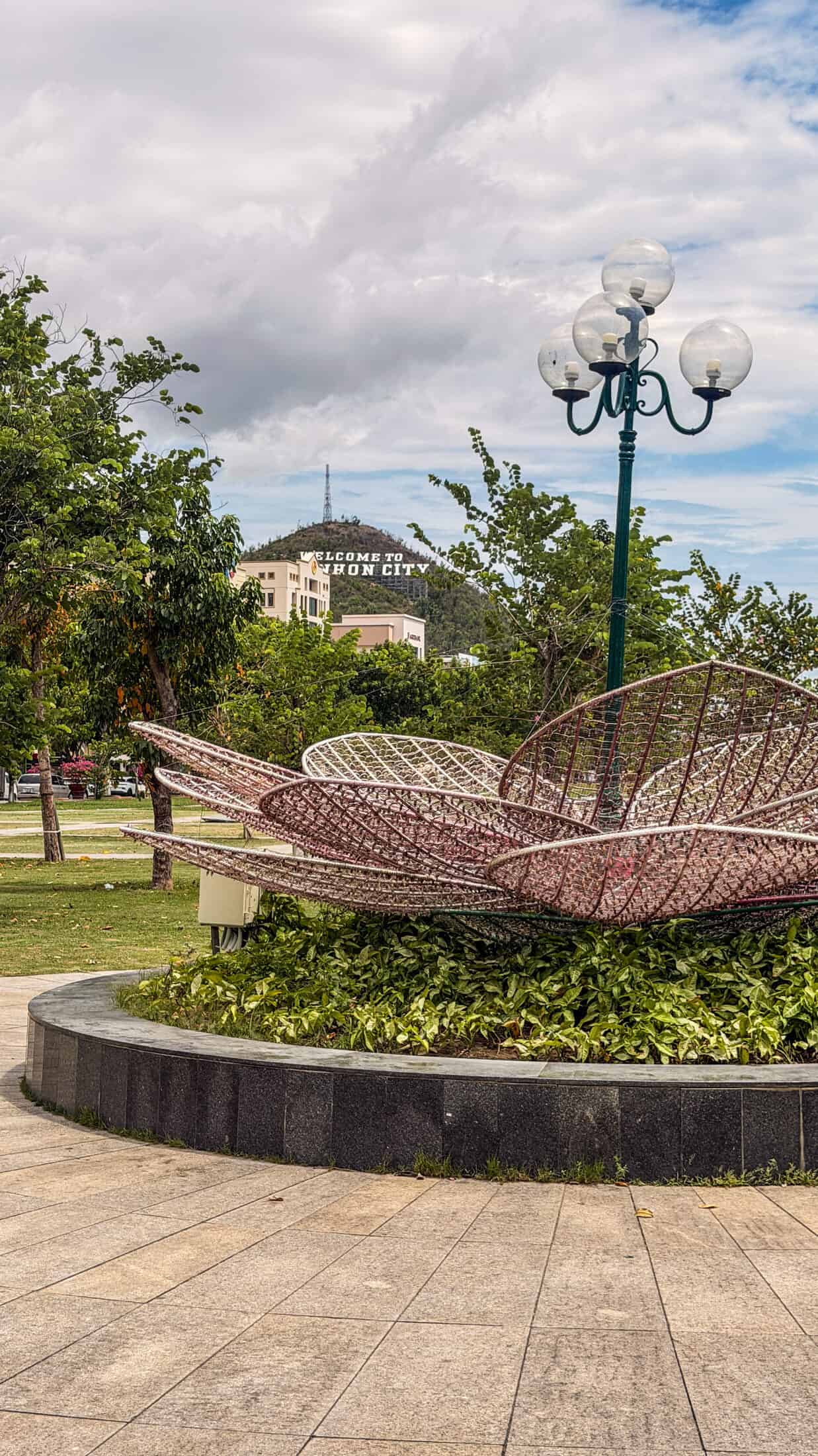 Flowering shrubs and walking paths at Quy Nhon Green Square