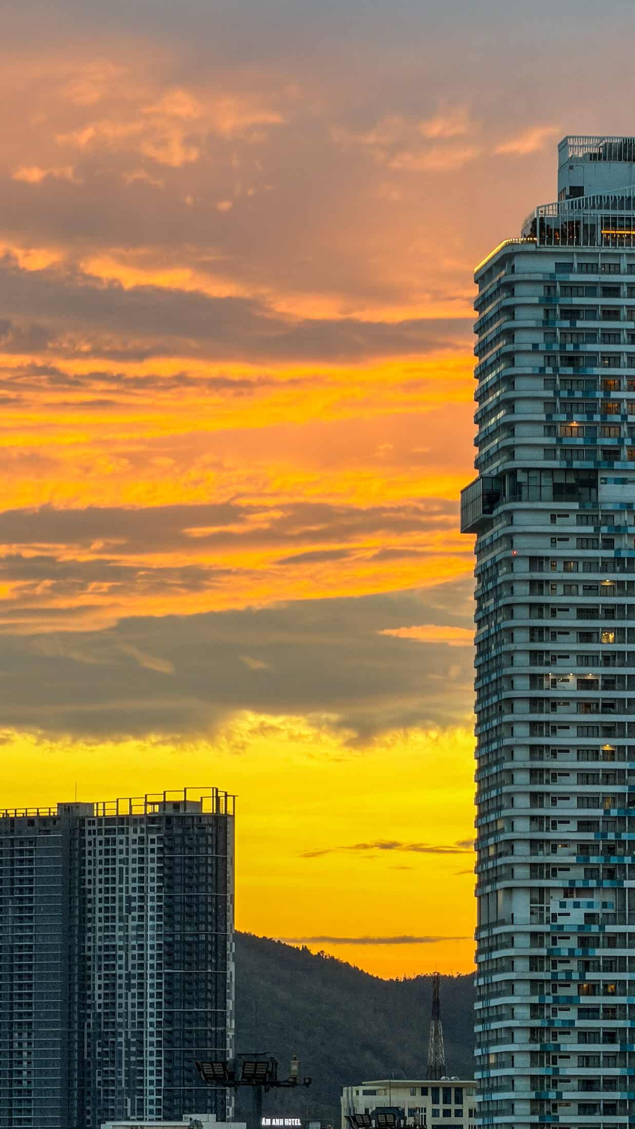 Sunset along Quy Nhon's promenade with towers silhouetted