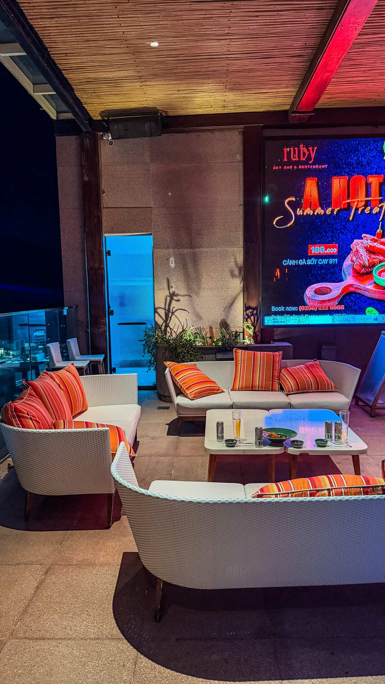 Rooftop pool overlooking the city at night at Ruby Sky Bar & Restaurant, Quy Nhon