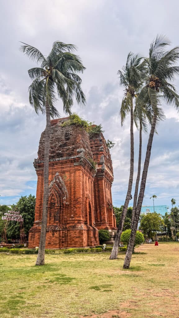 Tháp Đôi Cham twin towers in Quy Nhon framed by palm trees