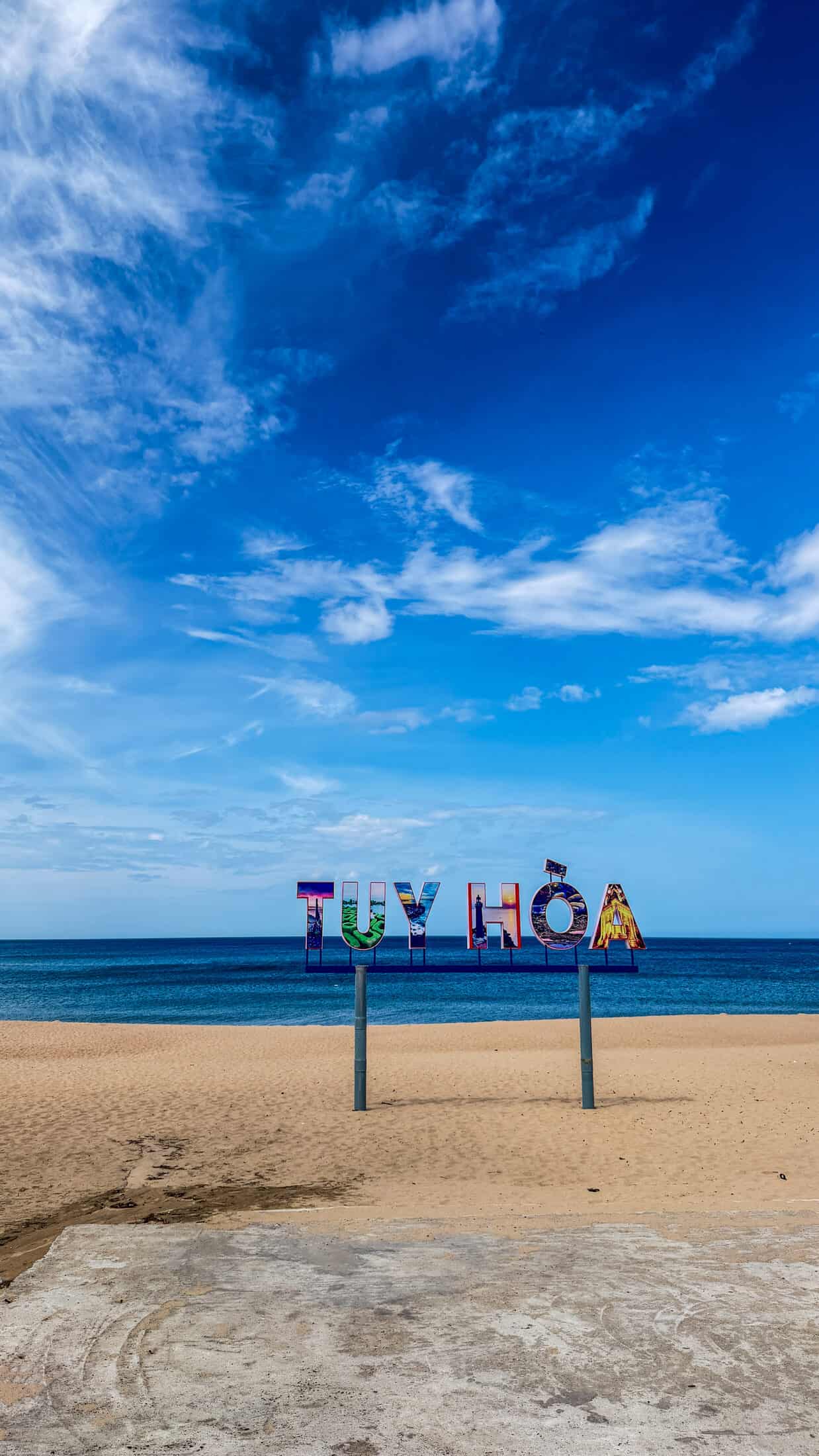 Large 'Tuy Hoa' letter sign installed on the beach for photos
