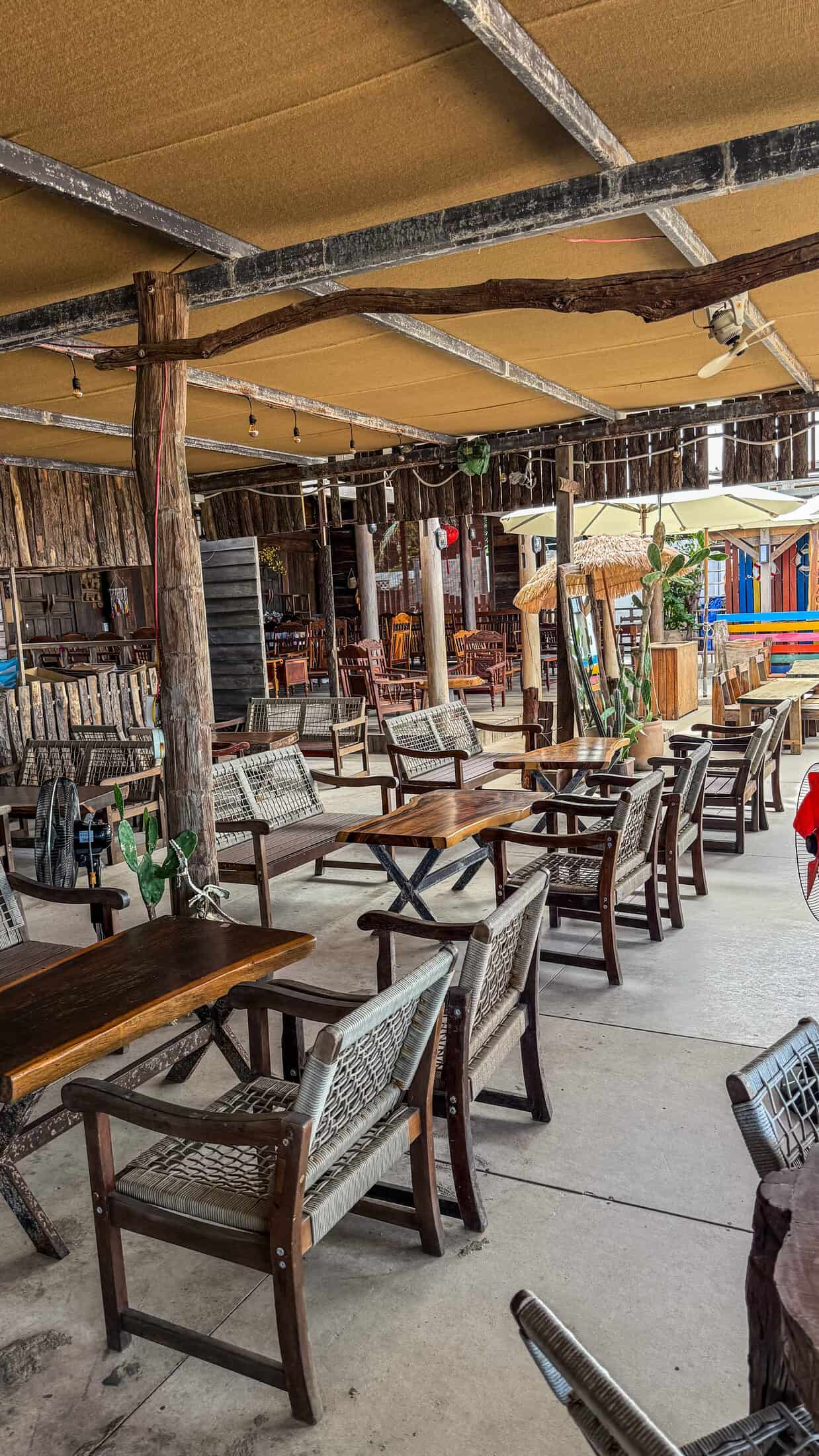 Large canvas-shaded lounge seating area at URA Beach Camping & Coffee, Tuy Hoa