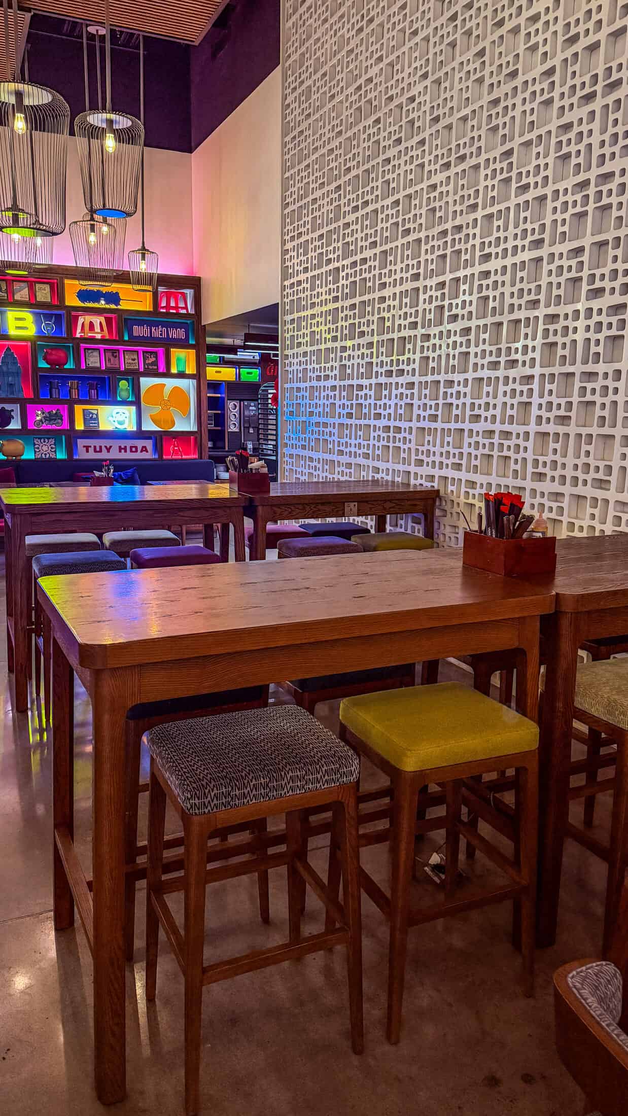 Bar seating and pop-art Tuy Hoa mural at Wink Tuy Hoa Beach