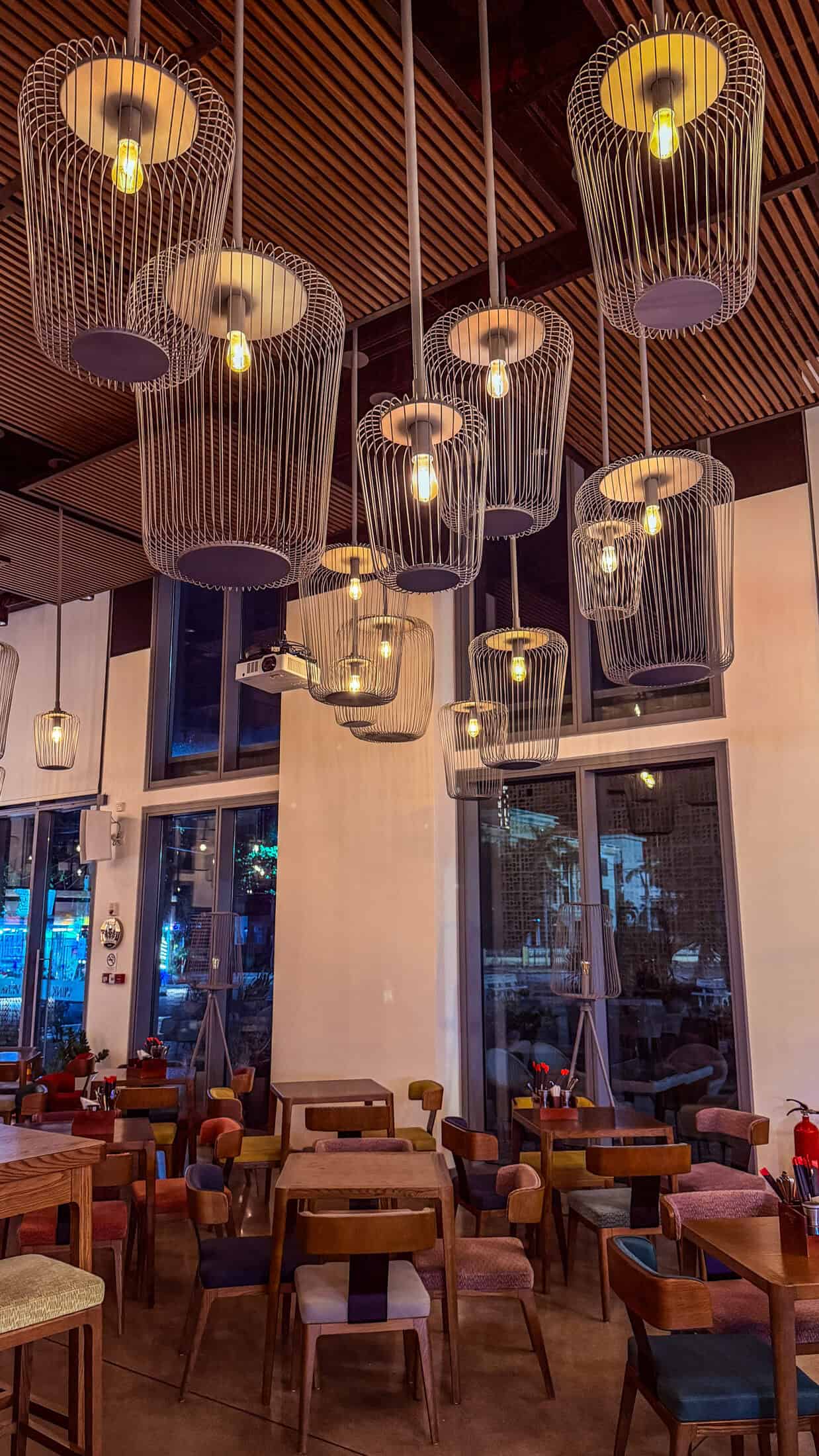Cage-style pendant lighting in the restaurant at Wink Tuy Hoa Beach
